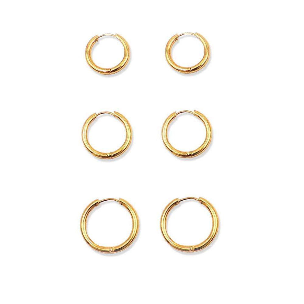 Six plain polished small gold-tone huggie earrings arranged on a white background