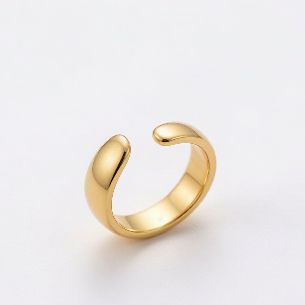 A plain polished gold-tone open adjustable ring, shown face on against a white background
